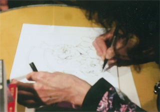 漫画を描く石坂さん